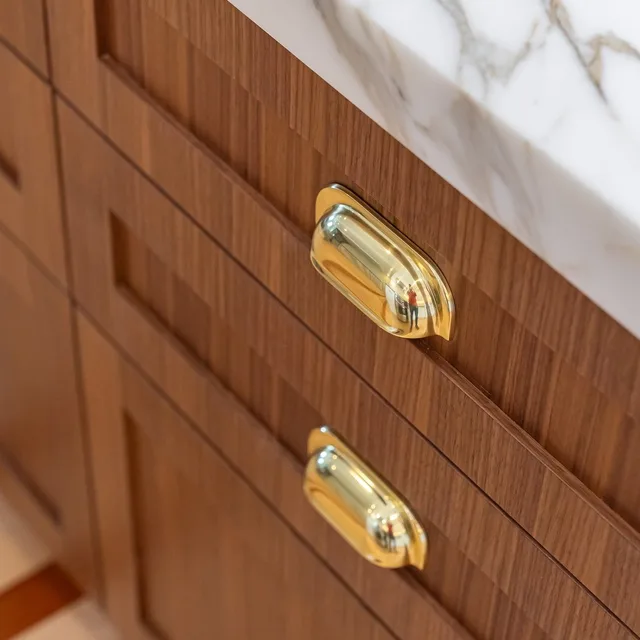 Cabinetry details in walnut & brass